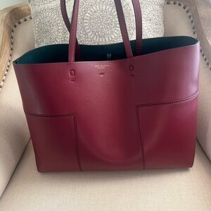 Tory Burch leather burgundy handbag - 17” X 11”.
